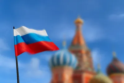 Флаг России развевается на фоне голубого неба Stock Photo | Adobe Stock