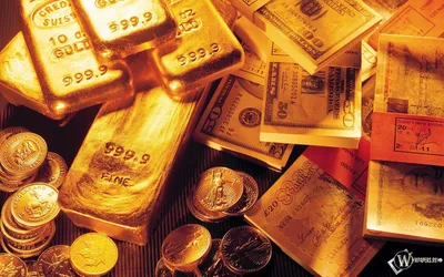 Слитки золота лежат на деньгах - обои на рабочий стол
