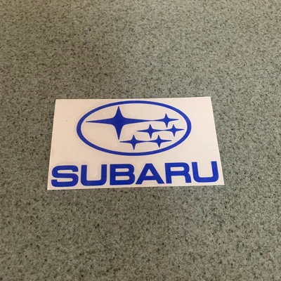 Close-up of the Logo at the Front of a Subaru WRX · Free Stock Photo